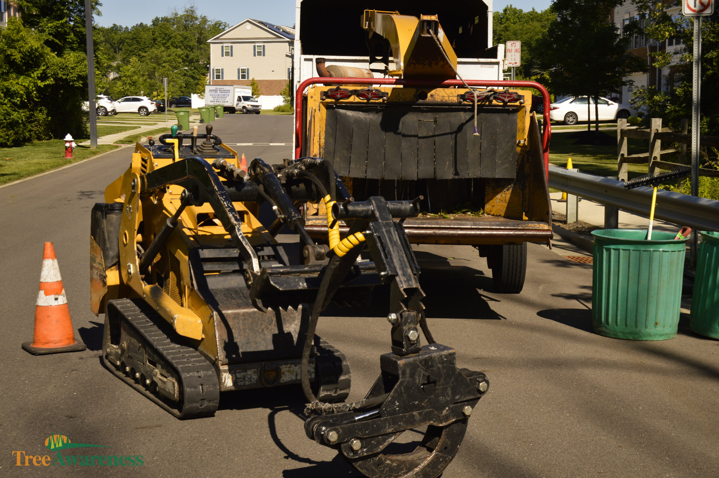 Tree Awareness mini-loader and chipper on a South Jersey job site.