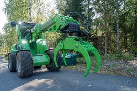 Compact loader used for stump grinding work